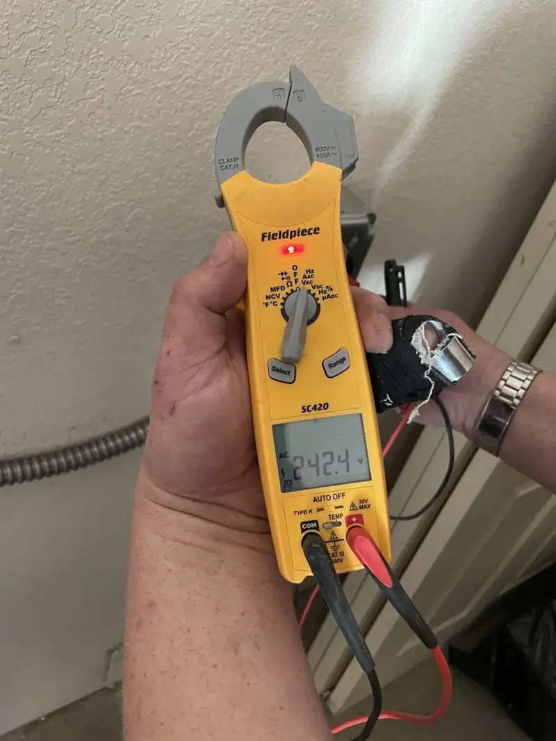 Voltage testing with clamp meter during Ceiling Fan Installation in Eagle Point